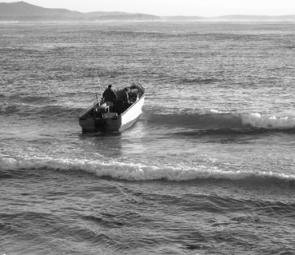 This is no time to be saying, ‘Start, you %^*#&!’ Power tilt is a huge advantage in quickly lowering the engine but rocks and hard sand here could mean some ugly moments in the wave troughs. The prop is lowered just enough to give it some water to work wi